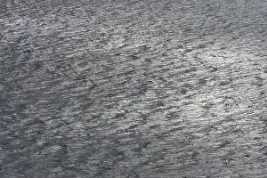 Light On Water Surface Drucke: Light and shadow on small waves on the sea