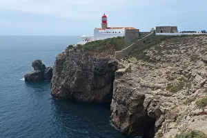 Steep Cliff Coastal Area Drucke: Lighthouse on a cliff overlooking the open sea