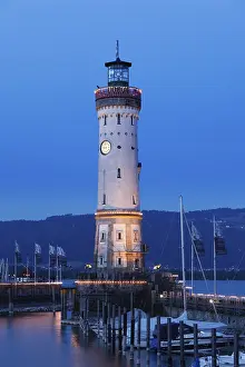 Bavaria Evening Atmosphere Drucke: Lighthouse at the harbour at dusk
