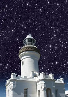 Deserted Lighthouse Tower Drucke: Lighthouse with a view upwards against the starry sky