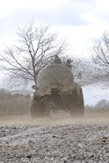 Agricultural Field Work Drucke: Liquid manure is distributed on field