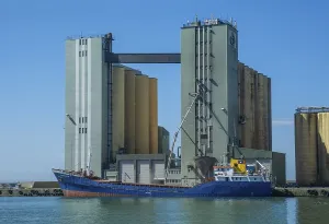 Scandinavian Agriculture Scene Drucke: Loading of grain from silo to ship in Ystad harbour