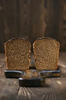 Gourmet Bakery Products Drucke: Loaf of artisan rye bread cut on half