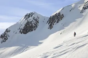 Ski Touring Drucke: A lone skier ascends a pristine
