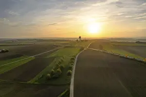 Baden Wurttemberg Landscape Shot Drucke: Long fields and a tower in low sun