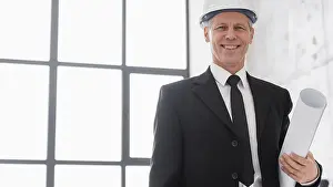 Safety Helmet Man Drucke: Low angle engineer male with plans