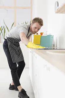 Cleanliness In Food Preparation Drucke: Low angle man cleaning kitchen