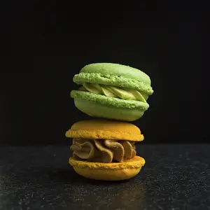 Foodstuff Photography Drucke: Two macarons on a black background