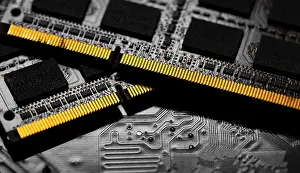 Close Up Electronic Components Drucke: Macro Close up of computer RAM chip and motherboard on dark background