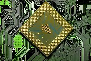 Electronic Communication Network Drucke: Macro Close up of microchips and pins on Main CPU PC processor circuit board