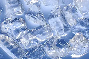 Deserted Ice Cube Scene Drucke: Macro of ice cubes in a blue bin