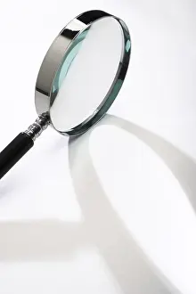 Detail View Photography Drucke: Magnifying glass casting a shadow