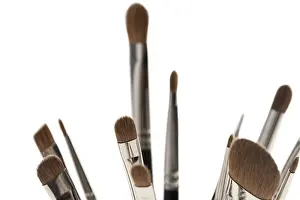 Studio Shot Beauty Products Drucke: Make up brushes of different size and type object isolated close up cropped view on white