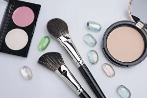 Gray Background Beauty Shot Drucke: Make up brushes, eyeshadow and powder cases high angle object view against gray background