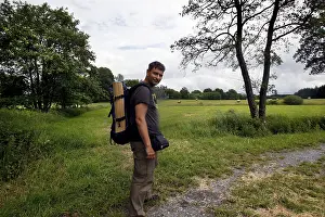 Environmental Protection Germany Drucke: Man with backpack, hiker in the border triangle