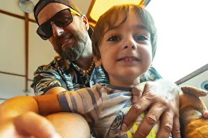 Father Son Relationship Images Drucke: A man and a boy are sitting together