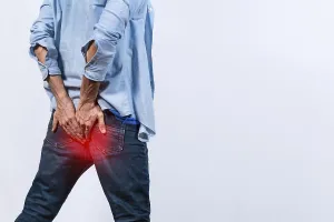 Diarrhea Symptoms Drucke: Man with digestive problem touching his buttock