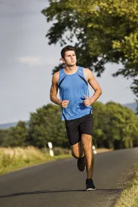 Athletic Movement Drucke: Man jogging through the fields