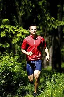 Recreational Activity Man Drucke: Man jogging in forest