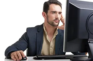 Professional Man At Work Drucke: Man looking at a computer screen