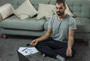Calm And Serene Atmosphere Drucke: Man meditating sofa before starting work
