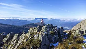 Spanish Mountain Scenery Drucke: A man at the top of Mount Adarra