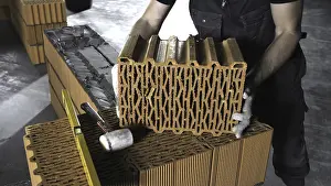 Brick Wall Drucke: Man puts a brick on a brick wall