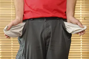 Bankruptcy Image Drucke: Man showing his empty pockets