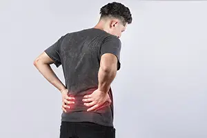 Back Pain Concept Drucke: Man with spine problems isolated