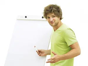Male Model Looking At Camera Drucke: Man standing in front of a flip chart
