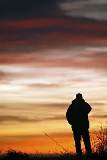Evening Sky Photography Drucke: Man at sunset
