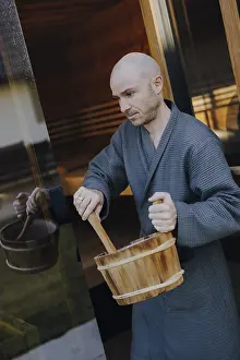 Man In Sauna Drucke: Man taking a sauna