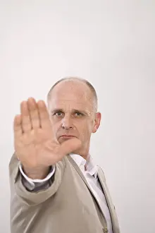 Rejection Gesture Drucke: Man thrusting his hand forward in defense