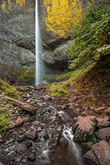 Basalt Stone Landscape Drucke: Man at waterfall in front of basalt rock