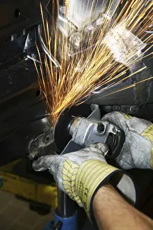 Protective Clothing Detail Drucke: Man working with angle grinder