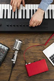 Professional Recording Studio Drucke: Man working in home record studio. View from above