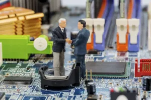 Printed Circuit Board Image Drucke: Two managers on computer board