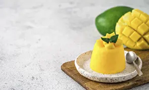 Food Copy Space Drucke: Mango Mousse on gray cement background with copy space left
