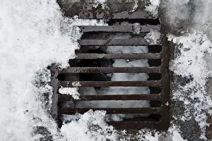 Winter Scene Photography Drucke: Manhole cover in winter