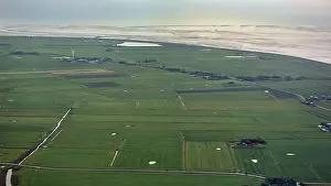 UNESCO World Natural Heritage Site Aerials Drucke: Meadows and fields with a single wind turbine