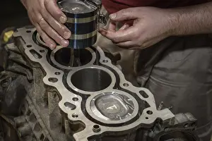 Deserted Workshop Scene Drucke: The mechanic repairs the car engine in the workshop