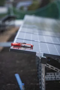 Solar Energy Installation Drucke: Solar modules and tools on a rack