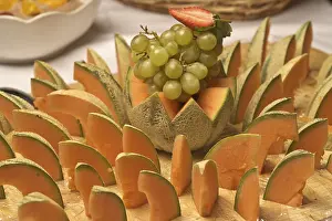 Fruity Food Photography Drucke: Melons and grapes on a board, buffet