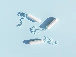 Cleanliness And Hygiene Products Drucke: Menstrual tampons with thread blue background