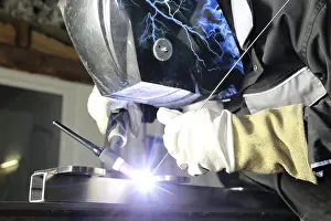 Steel Construction Drucke: Metal worker during welding work