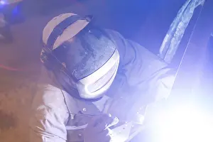 Industrial Craftsman Drucke: Metal worker during welding work