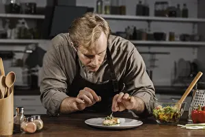 Beef Meal Drucke: Mid shot chef plating dish
