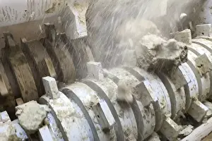 Deserted Industrial Building Drucke: Millstone of the machine for grinding clay