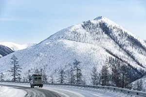 Deserted Mountain Roads Drucke: Minivan driving on the Road of Bones