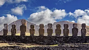 Easter Island Landscape Drucke: Moai statues against a mountain backdrop and dramatic sky with clouds
